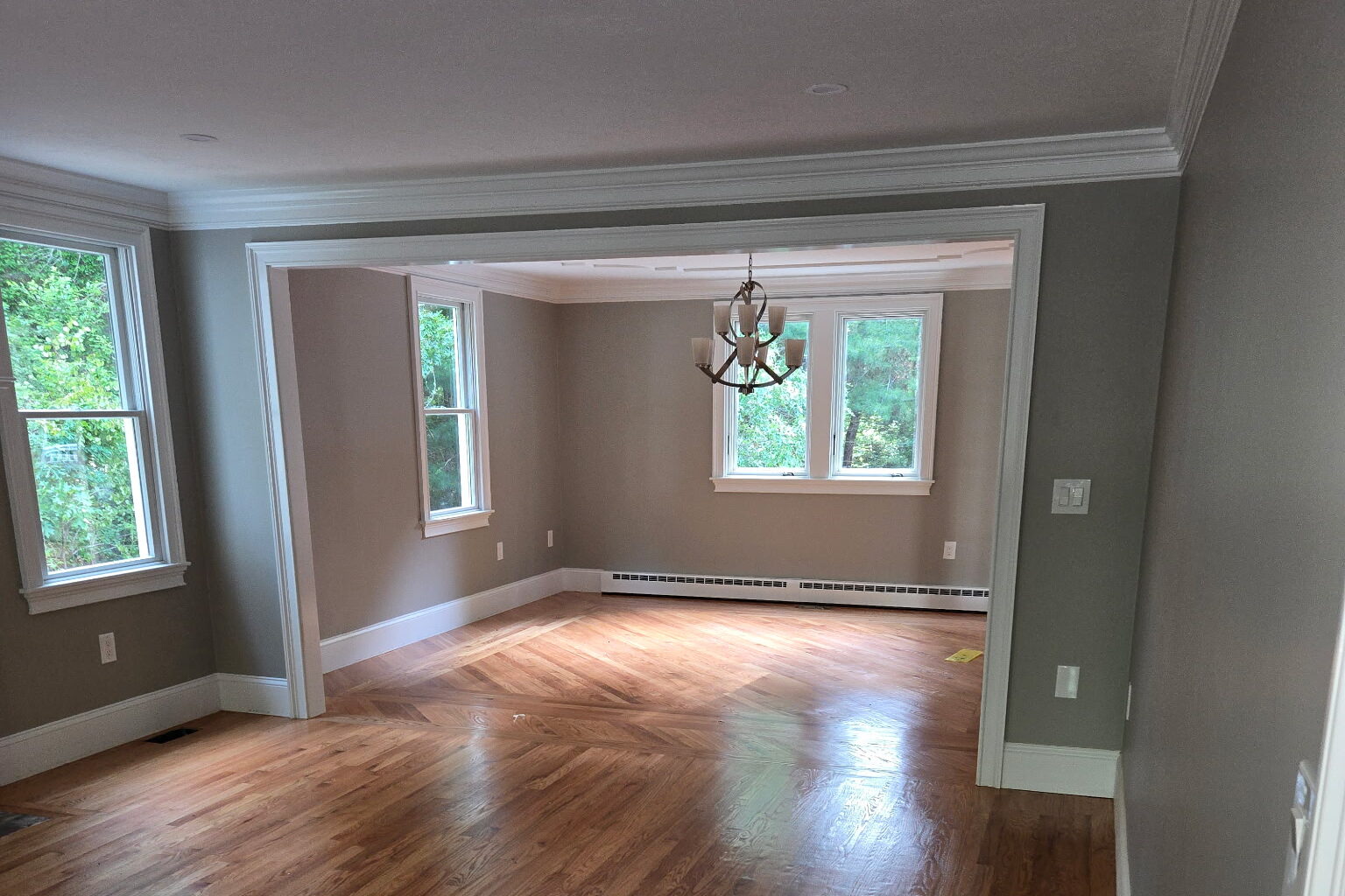 Empty room with hardwood floors.