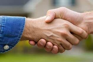 Two hands shaking in agreement.