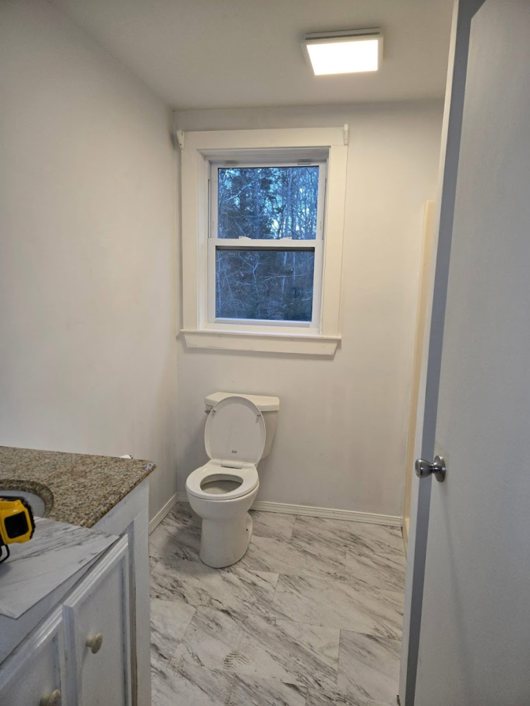 Clean, modern bathroom with window - photo left by customer in reviews