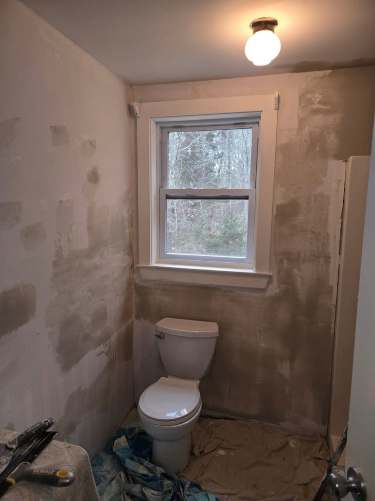 Unfinished bathroom with bare walls - photo left by customer in reviews