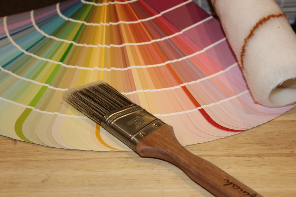 Paint swatches and brush on table